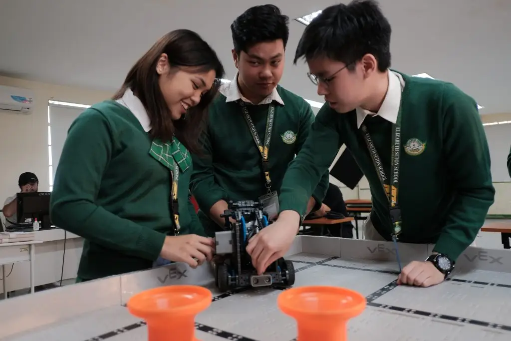 students w robot on robotics field